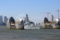 HMS PORTLAND passes through the THAMES BARRIER