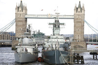 HMS Exeter berths alongside HMS Belfast London